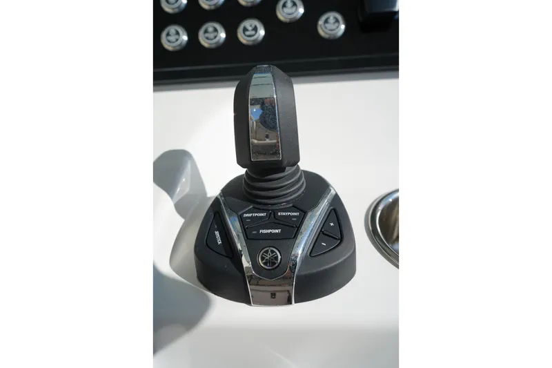 Slide: The Image of Joystick control panel on 2024 Edgewater 285CC boat dashboard. - 29