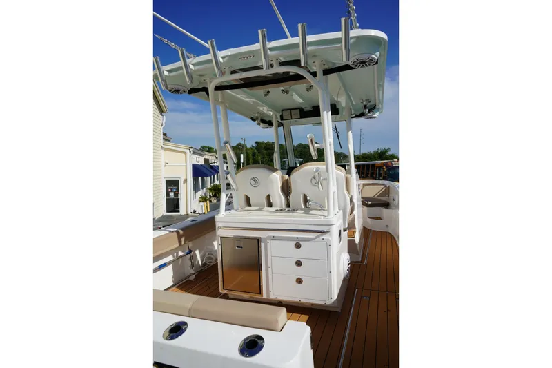 Slide: The Image of 2024 Edgewater 285CC boat interior with seating and storage, featuring a sleek design. - 3