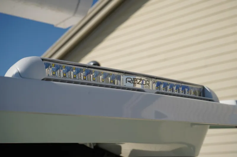 Slide: The Image of LED light bar on 2024 Edgewater 285CC boat, featuring Razor branding. - 40