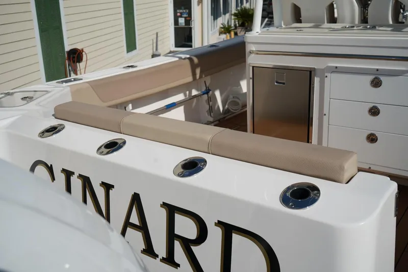 Slide: The Image of 2024 Edgewater 285CC boat interior with seating and storage compartments. - 5