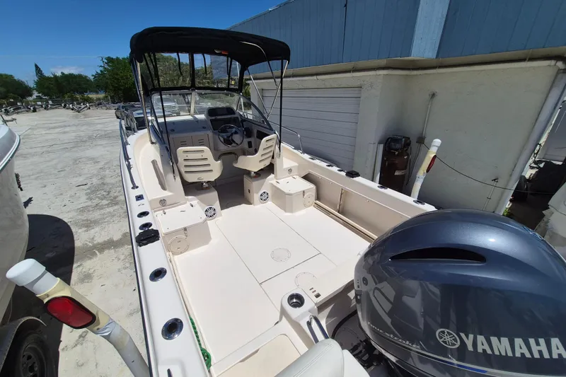 Slide: The Image of 2022 Grady-White Adventure 208 boat with Yamaha engine, docked outdoors. - 16