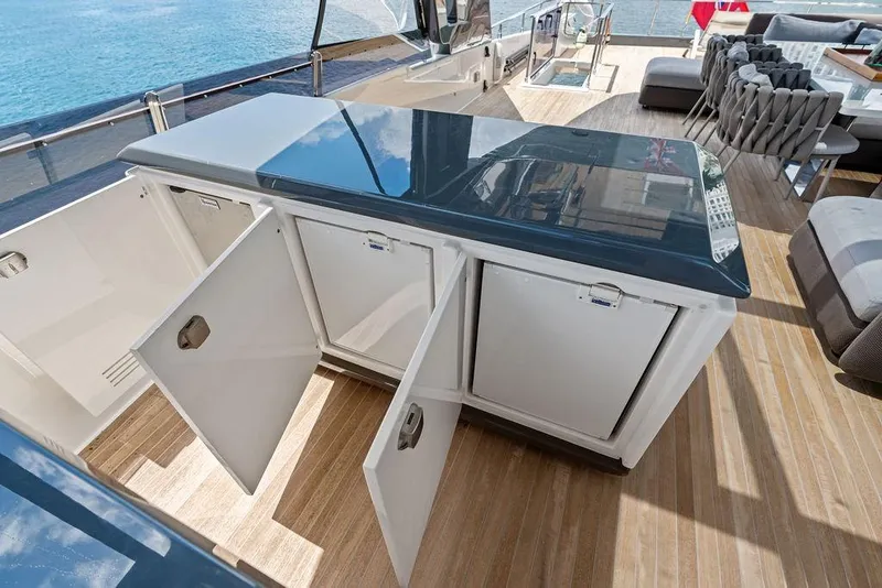 Slide: The Image of Luxurious 2018 Ferretti Yachts 850 Motoryacht deck with open storage compartments. - 21