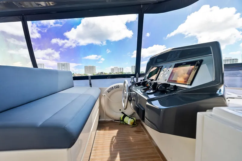 Slide: The Image of 2018 Ferretti Yachts 850 Motoryacht helm with modern controls and panoramic view. - 26
