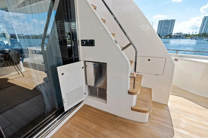 Slide: The Image of 2018 Ferretti Yachts 850 Motoryacht deck with stairs and waterfront view. - 29