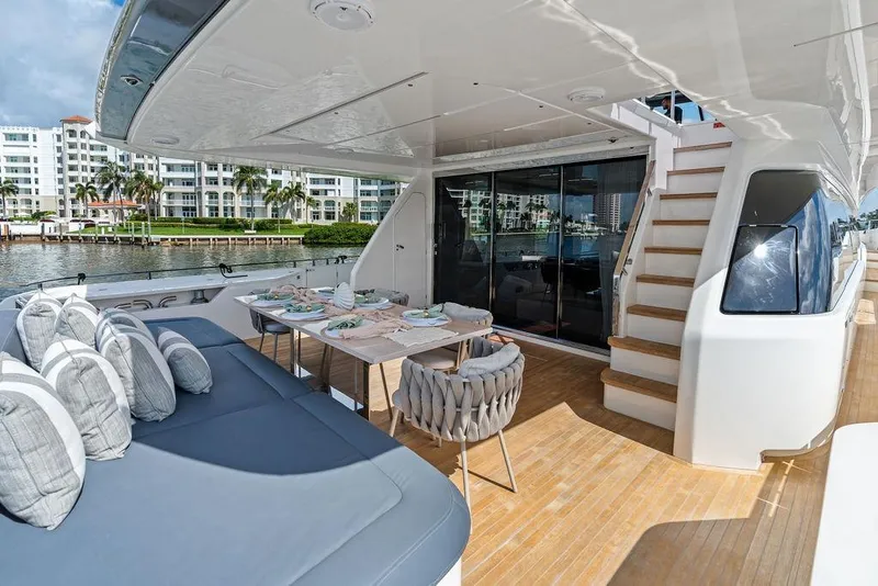 Slide: The Image of Luxurious 2018 Ferretti Yachts 850 Motoryacht deck with dining area and seating. - 30