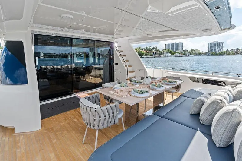Slide: The Image of Luxurious 2018 Ferretti Yachts 850 Motoryacht with elegant outdoor dining area and waterfront view. - 31