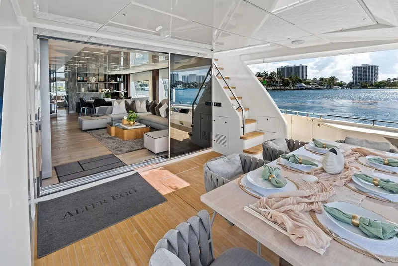 Slide: The Image of Luxurious 2018 Ferretti Yachts 850 Motoryacht interior with elegant dining setup and waterfront view. - 35