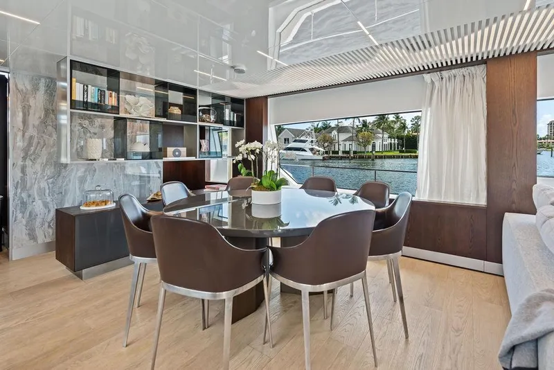 Slide: The Image of Luxurious dining area on 2018 Ferretti Yachts 850 Motoryacht with elegant decor and waterfront view. - 46