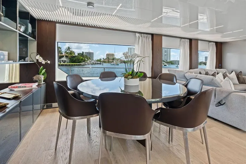 Slide: The Image of Luxurious interior of 2018 Ferretti Yachts 850 Motoryacht with elegant dining area and waterfront view. - 47