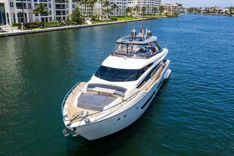 Slide: The Image of 2018 Ferretti Yachts 850 Motoryacht cruising on a scenic waterway. - 5