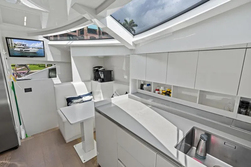 Slide: The Image of Luxurious 2018 Ferretti Yachts 850 Motoryacht interior with modern kitchen and seating area. - 52