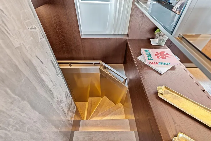Slide: The Image of Staircase in 2018 Ferretti Yachts 850 Motoryacht with wooden finish and decorative items. - 57