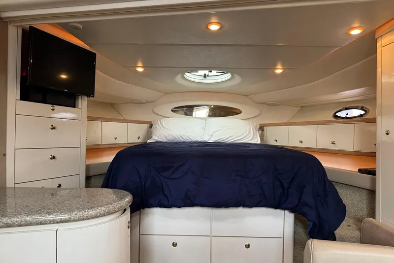 Slide: The Image of Luxurious cabin interior of 1998 Maxum 4100 SCR yacht with cozy bed and modern amenities. - 11