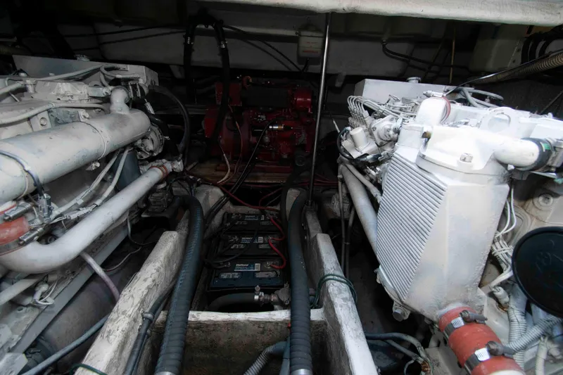 Slide: The Image of Engine compartment of a 1998 Maxum 4100 SCR boat, showcasing dual engines and components. - 20