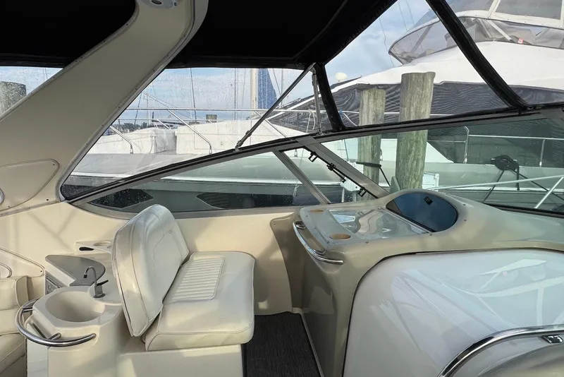 Slide: The Image of Interior view of 1998 Maxum 4100 SCR yacht cockpit with seating and helm. - 4