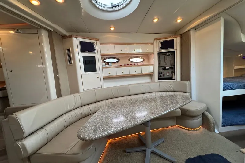 Slide: The Image of Luxurious interior of a 1998 Maxum 4100 SCR yacht with elegant seating and modern amenities. - 9