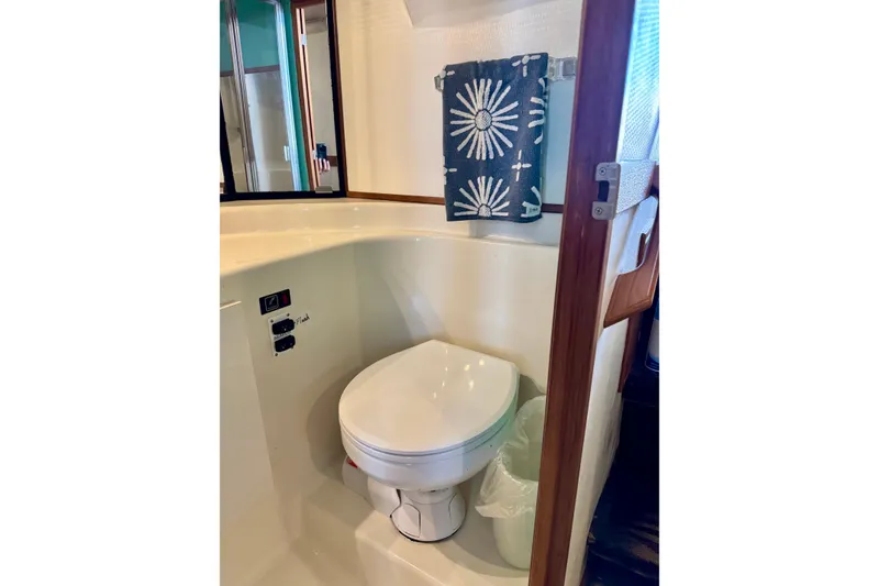 Slide: The Image of Bathroom interior of 2001 Bayliner 4788 Pilot House Motoryacht with modern fixtures. - 12