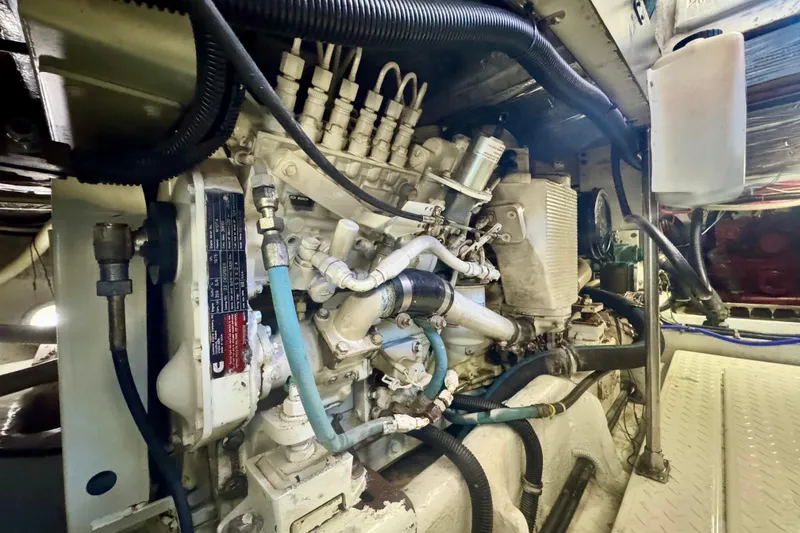 Slide: The Image of Engine room of a 2001 Bayliner 4788 Pilot House Motoryacht, showcasing mechanical components. - 17
