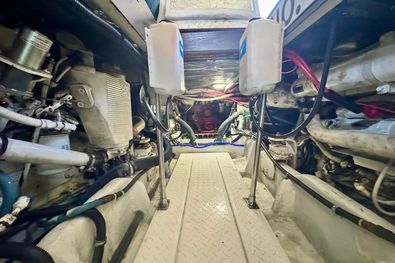Slide: The Image of Engine room of 2001 Bayliner 4788 Pilot House Motoryacht, showcasing mechanical components. - 18