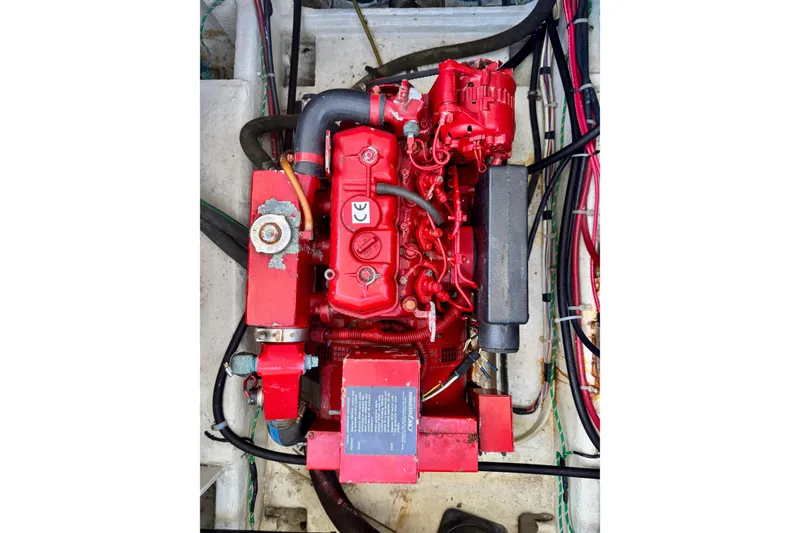 Slide: The Image of Engine of 2001 Bayliner 4788 Pilot House Motoryacht, featuring red components and wiring. - 19