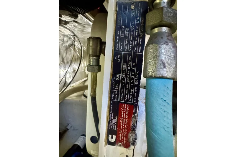 Slide: The Image of Engine label on a 2001 Bayliner 4788 Pilot House Motoryacht, showing specifications and connections. - 20