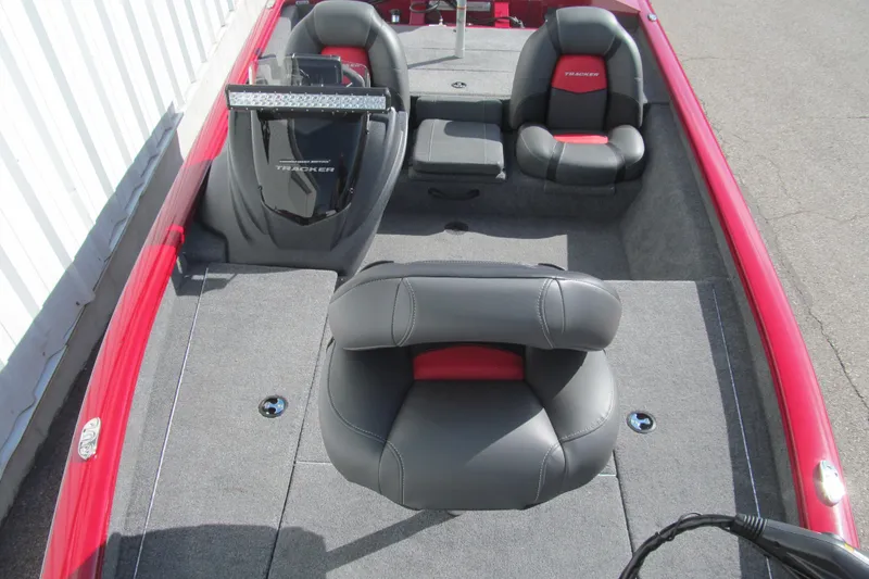 Slide: The Image of 2025 Tracker Pro Team 175 boat interior with gray and red seating. - 10