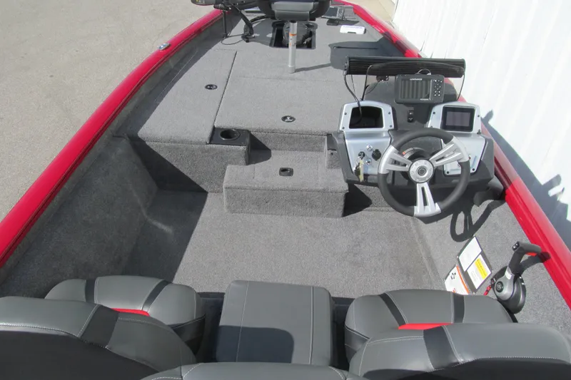 Slide: The Image of Interior view of 2025 Tracker Pro Team 175 boat with steering wheel and seating. - 5