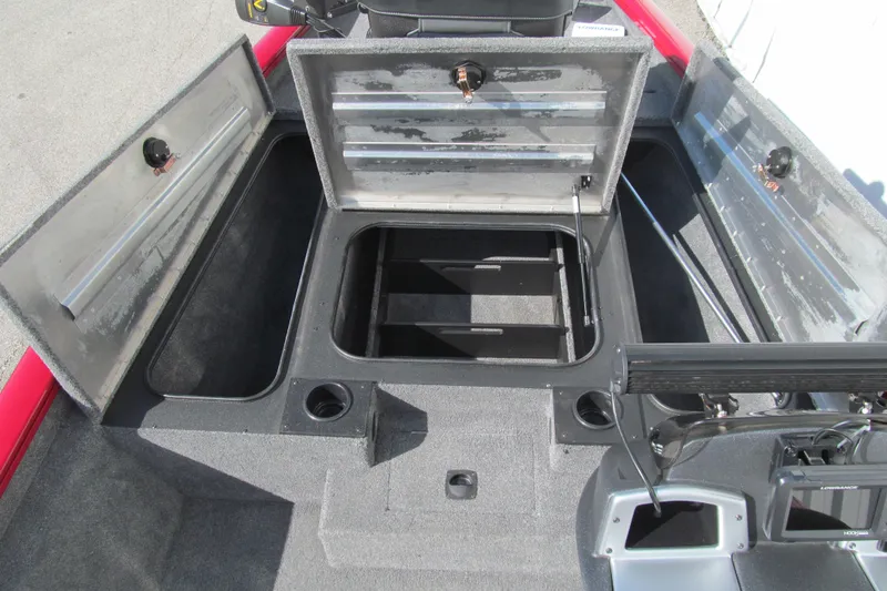 Slide: The Image of 2025 Tracker Pro Team 175 boat interior with open storage compartments. - 8