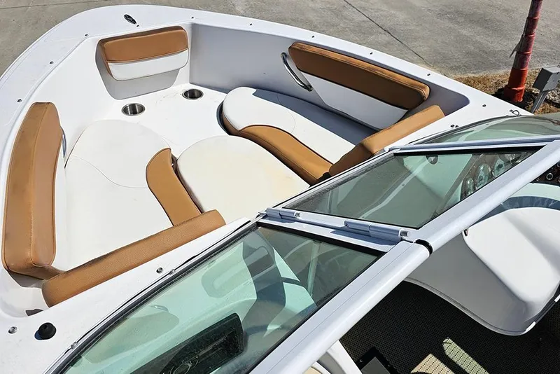 Slide: The Image of 2019 Caravelle 17 EBo Bowrider interior with tan and white seating. - 13