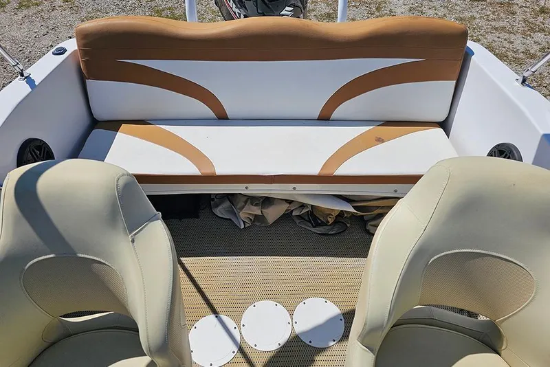 Slide: The Image of Interior of a 2019 Caravelle 17 EBo Bowrider boat with beige seating. - 19