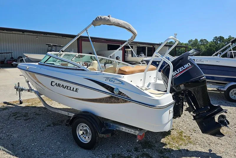 Slide: The Image of 2019 Caravelle 17 EBo Bowrider boat with Suzuki outboard motor on trailer. - 7