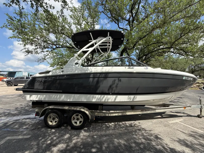 The Image of 2025 Cobalt R4 boat on trailer under trees. - 0