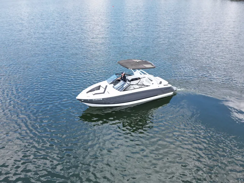 Slide: The Image of Cobalt R4 2025 motorboat cruising on calm water. - 24