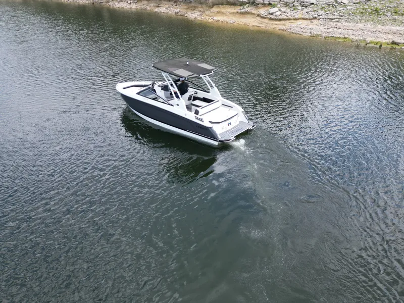 Slide: The Image of Cobalt R4 2025 boat cruising on calm water. - 25