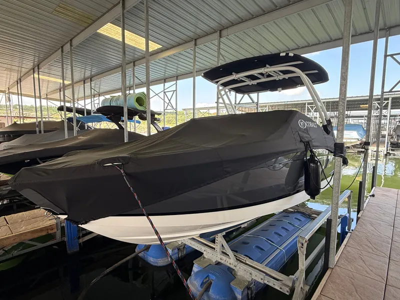 Slide: The Image of 2025 Cobalt R4 boat with cover in a covered dock. - 26