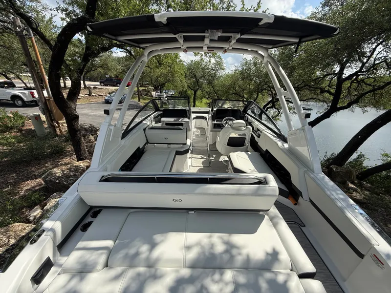 Slide: The Image of Interior view of 2025 Cobalt R4 boat, parked by the lakeside. - 3