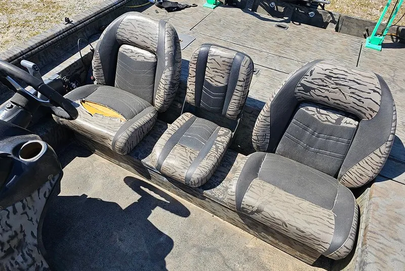 Slide: The Image of 2020 Xpress XP200 Catfish boat interior with camo-patterned seats. - 11
