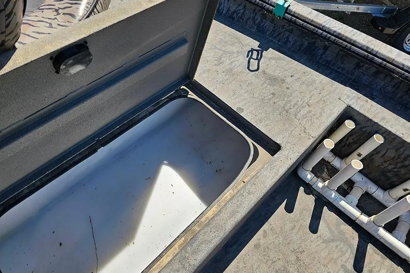 Slide: The Image of Open storage compartment on 2020 Xpress XP200 Catfish boat deck. - 16