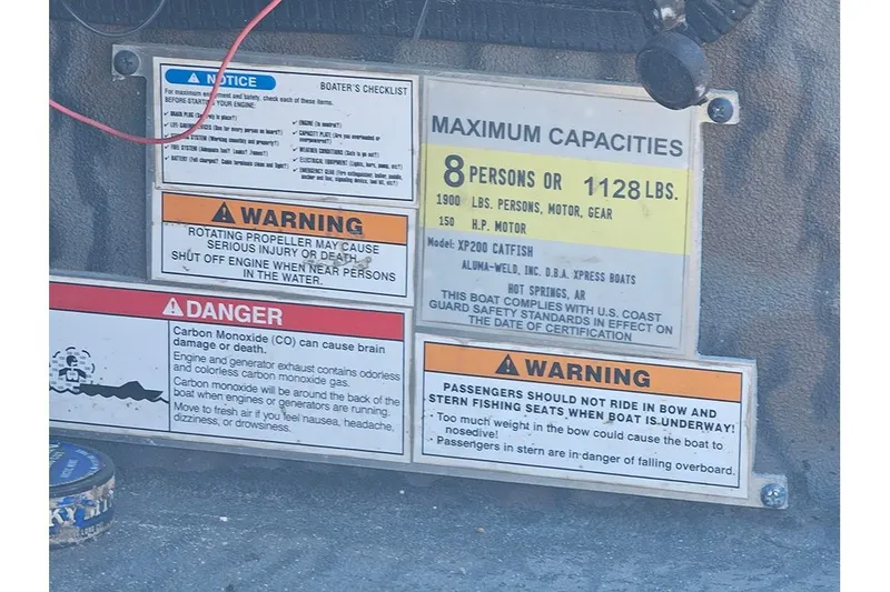 Slide: The Image of Safety warnings and capacity limits on 2020 Xpress XP200 Catfish boat dashboard. - 19