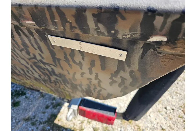 Slide: The Image of 2020 Xpress XP200 Catfish boat with camouflage pattern and visible identification plate. - 20