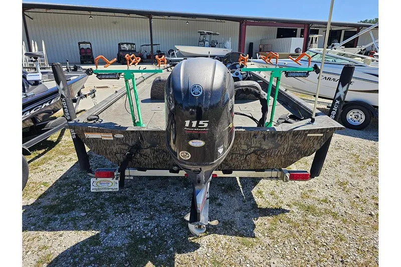 Slide: The Image of 2020 Xpress XP200 Catfish boat with Yamaha 115 outboard motor, parked outdoors. - 7