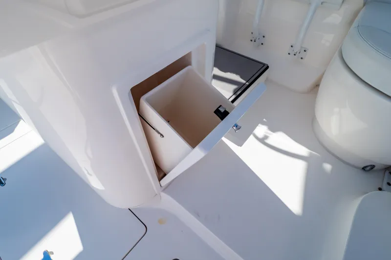 Slide: The Image of 2014 Intrepid 375 Walkaround boat interior with open storage compartment. - 102