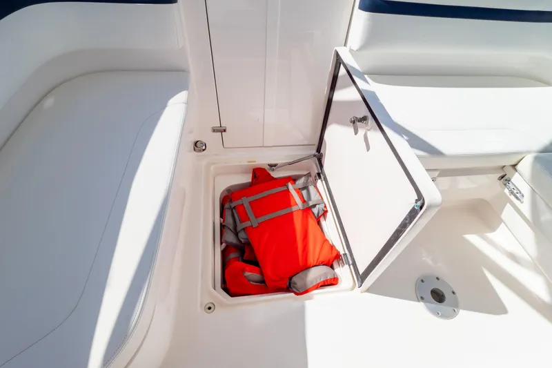 Slide: The Image of Storage compartment with life jackets on a 2014 Intrepid 375 Walkaround boat. - 108