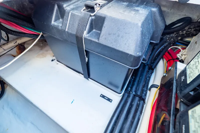 Slide: The Image of Battery compartment of a 2014 Intrepid 375 Walkaround boat with secured cables. - 116