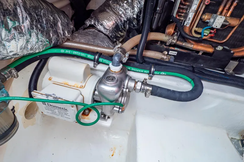 Slide: The Image of Engine compartment of a 2014 Intrepid 375 Walkaround with Dometic equipment and hoses. - 117