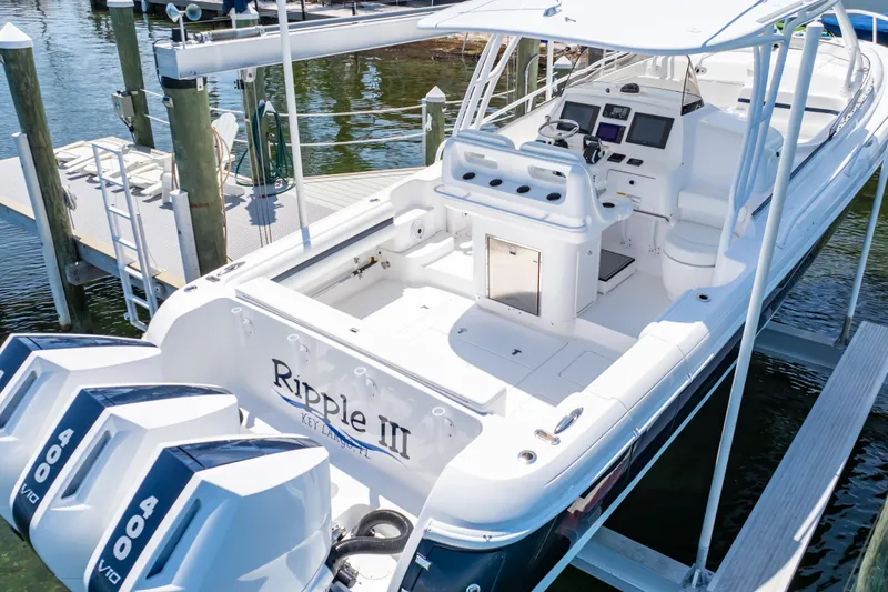 Slide: The Image of 2014 Intrepid 375 Walkaround boat docked, featuring dual 400 V8 engines. - 13