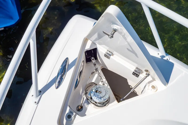 Slide: The Image of 2014 Intrepid 375 Walkaround anchor compartment with chain and winch. - 17