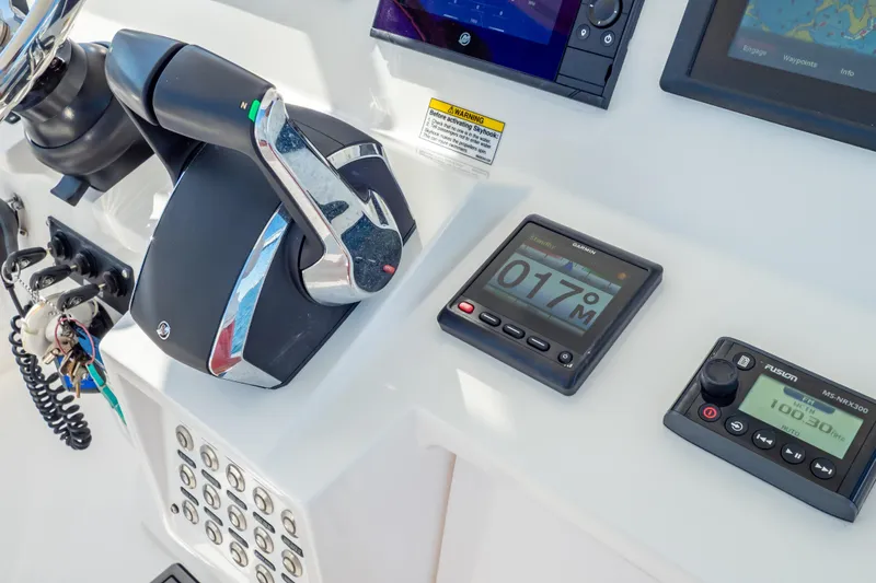 Slide: The Image of Control panel of a 2014 Intrepid 375 Walkaround boat with navigation instruments. - 20