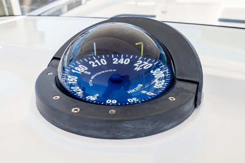 Slide: The Image of Compass on 2014 Intrepid 375 Walkaround boat, displaying navigational directions. - 24