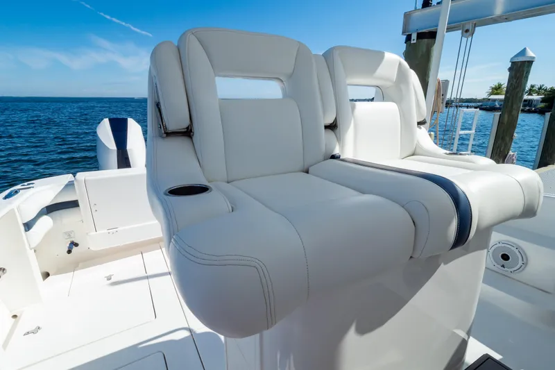 Slide: The Image of Luxurious seating on a 2014 Intrepid 375 Walkaround boat, overlooking the ocean. - 4